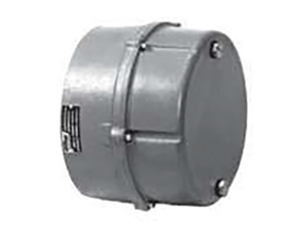 A round, metallic gray electrical junction box with a flat cover secured by four screws and a visible label on the side.
